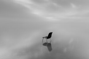 Greyscale Shot Chair Water Surface With Reflection Rainy Day 1 300x200